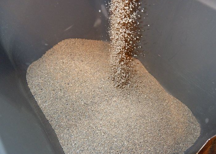 An image showcasing a box of all-natural clumping cat litter formula. The image highlights a type of cat litter that forms clumps when wet, emphasizing its potential benefits for ease of cleaning and maintaining a tidy litter box environment.