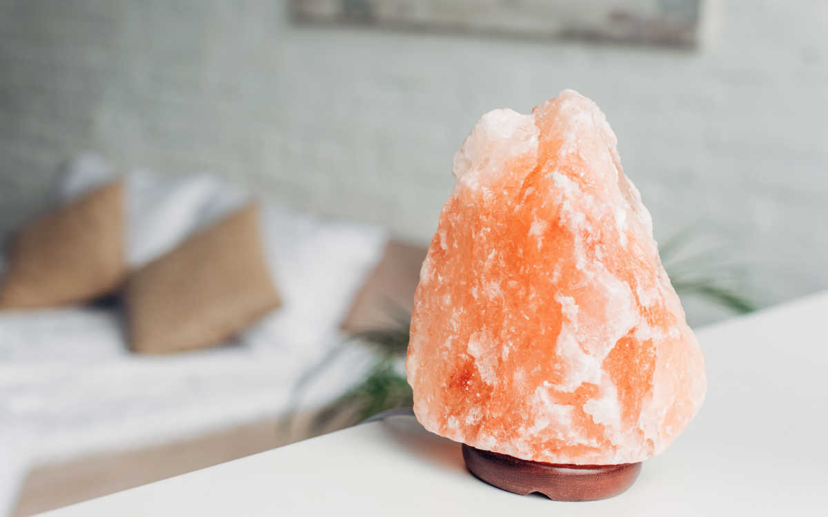 A Himalayan salt lamp emitting a warm and soothing glow, creating a tranquil and inviting ambiance