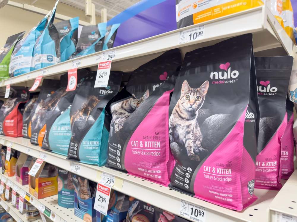 Multiple packages of Nulo cat food neatly arranged in a row.