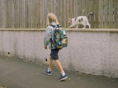 kiki-Walks-a-Boy-to-School-Daily