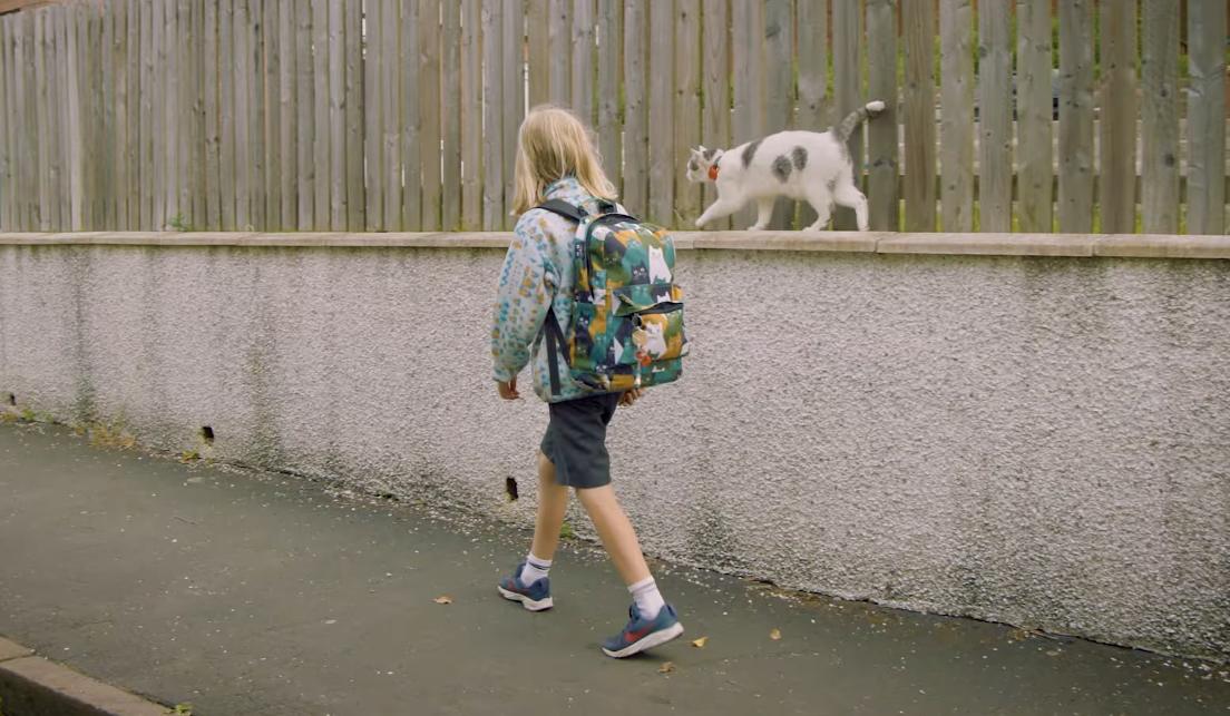 kiki Walks a Boy to School Daily